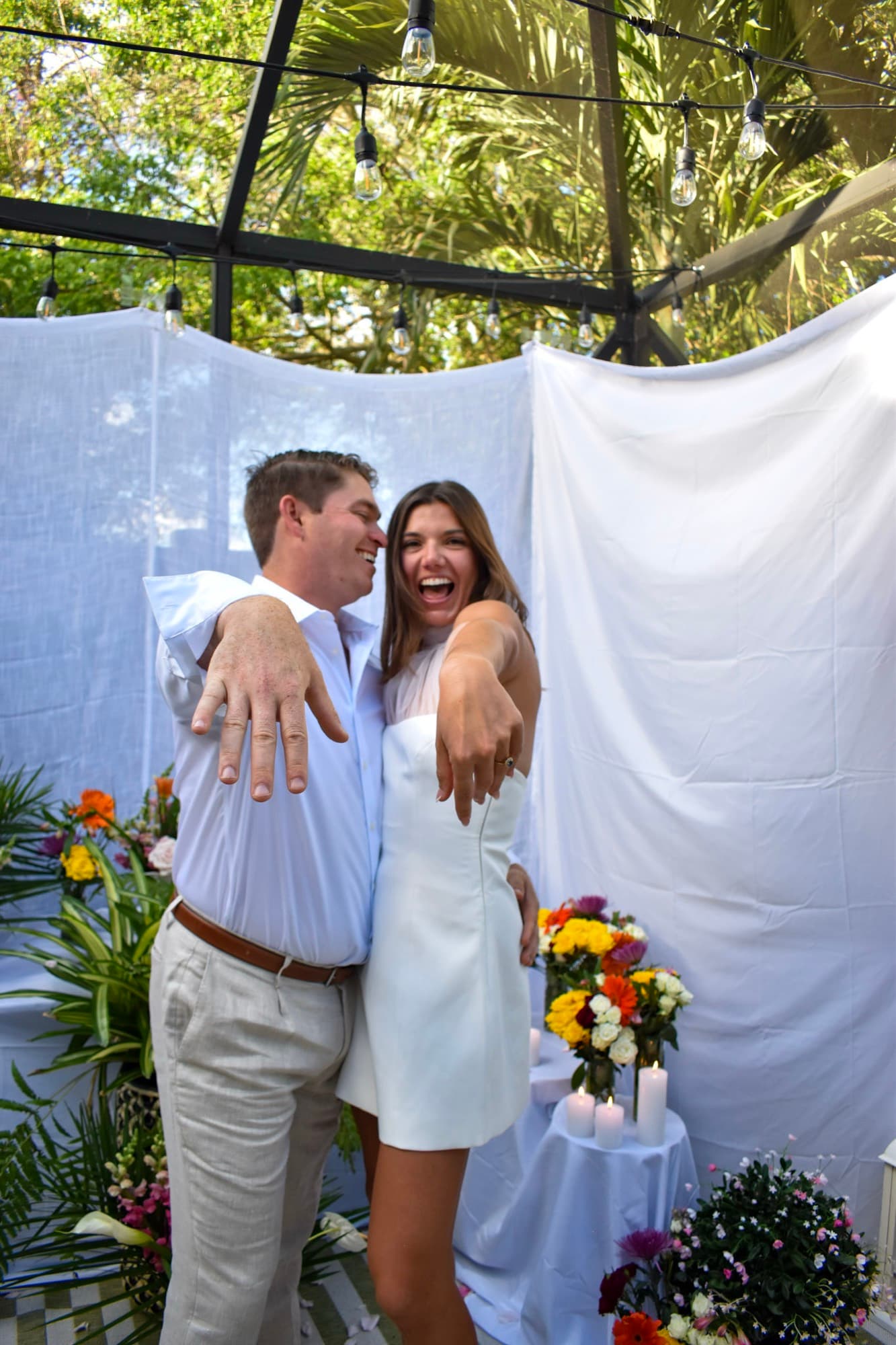 Morgan and Jon both holding their hands out to the camera, laughing.